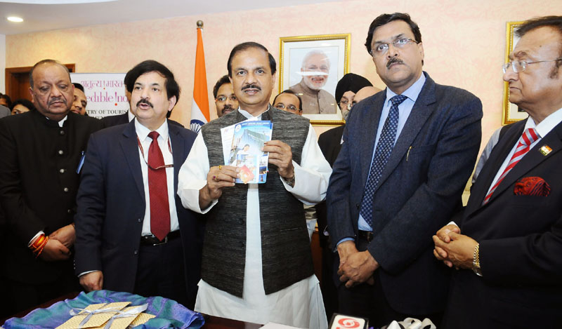 The Minister of State for Culture and Tourism (Independent Charge), Dr. Mahesh Sharma launching the presentation of Pre-Loaded Free SIM Cards for foreign tourists arriving in India on e-visa, in New Delhi on February 15, 2017. (PIB Photo)