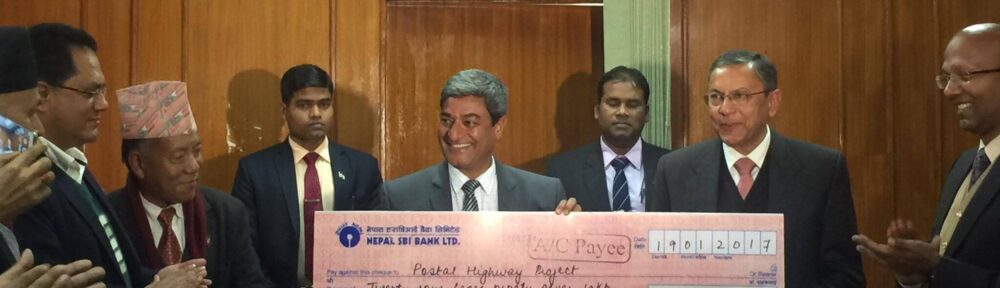 Indian Ambassador Ranjit Rae handed over a Cheque for four highway projects to Nepal Minister for Physical Infrastructure and Transport Mr. Ramesh Lekhak at Singha Durbar in Kathmandu on Monday, January 30, 2017. (Photo courtesy: Indian Embassy, Nepal)