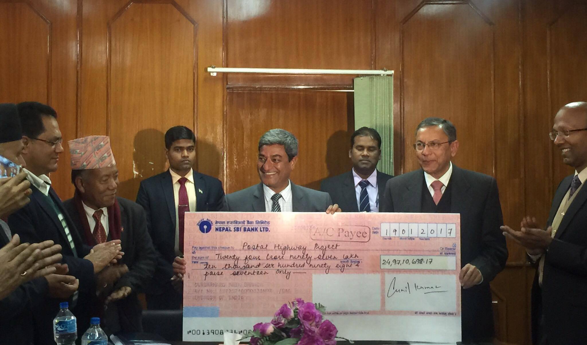 Indian Ambassador Ranjit Rae handed over a Cheque for four highway projects to Nepal Minister for Physical Infrastructure and Transport Mr. Ramesh Lekhak at Singha Durbar in Kathmandu on Monday, January 30, 2017. (Photo courtesy: Indian Embassy, Nepal)