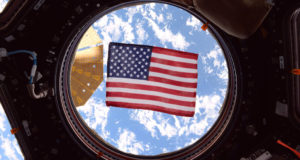 NASA astronaut Jack Fischer took this photograph of an American flag in one of the windows of the International Space Station's cupola, a dome-shaped module through which operations on the outside of the station can be observed and guided. Throughout NASA's history, spacecraft and launch vehicles have always been decorated with flags.(NASA)