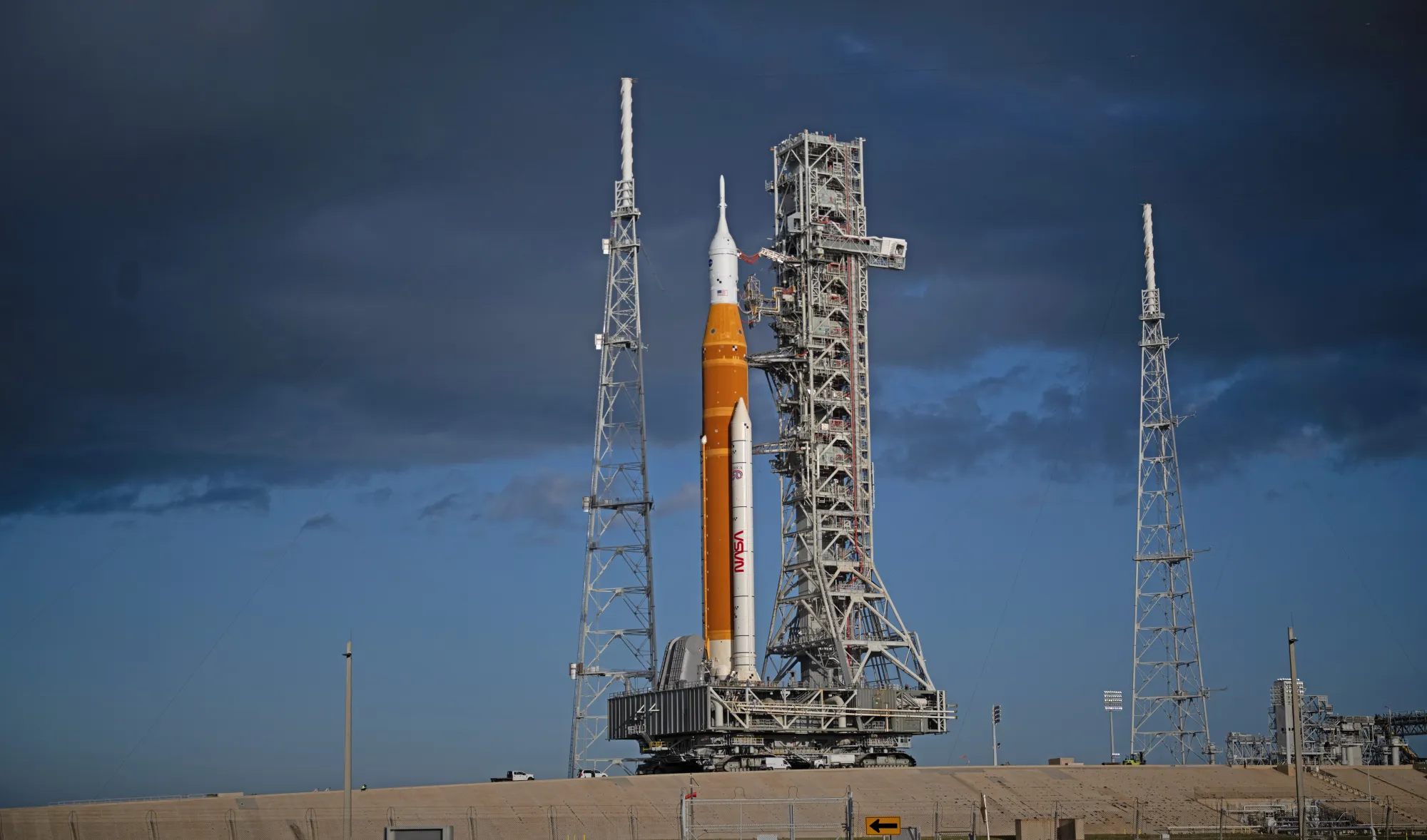 NASA’s SLS (Space Launch System) rocket and Orion spacecraft, secured to the mobile launcher, are seen as they arrive at the Launch Pad 39B, Friday, March 20, 2026, at NASA’s Kennedy Space Center in Florida. NASA/Joel Kowsky